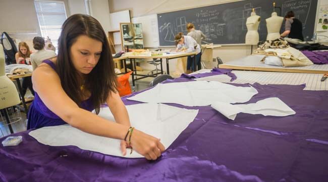 fashion design student working with fabric