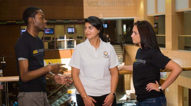 Students having discussion with professor