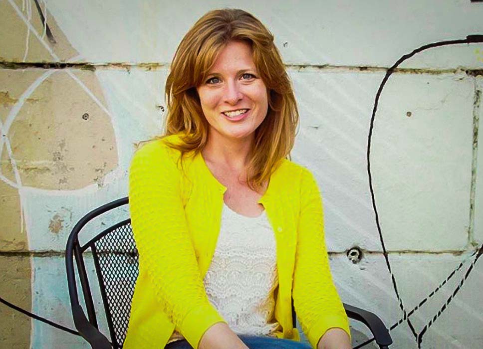 Woman sitting in chair outside