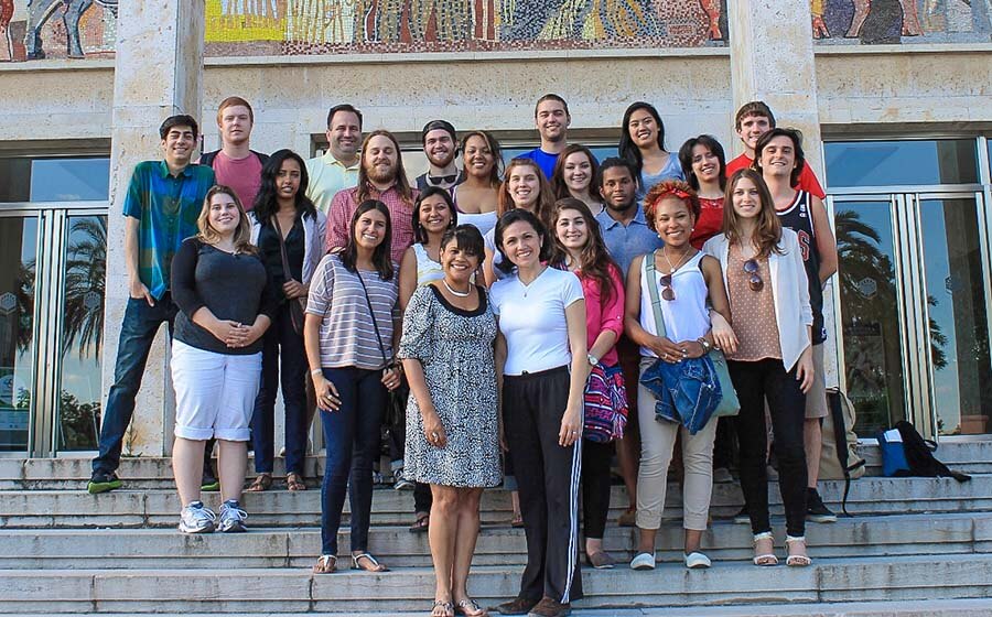 Large group of study abroad students posing on steps