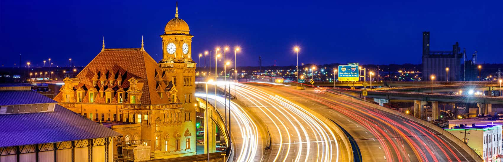 Nighttime view of highway going past Richmond train station