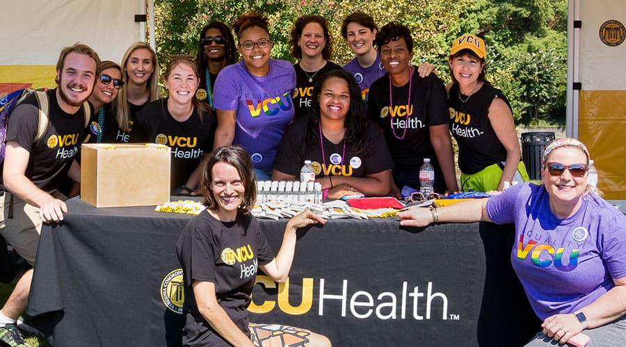 VCU Health team members staff a booth at PrideFest