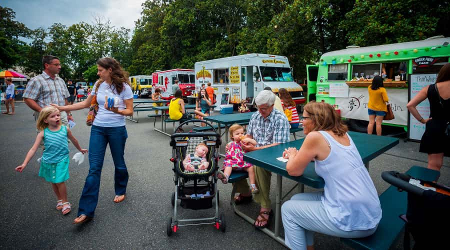 People eating at a Food Truck Court