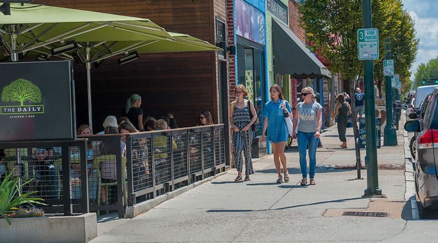 Pedestrians walk past the Daily Kitchen